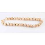 A JAPANESE MEIJI PERIOD CARVED IVORY BEAD NECKLACE,