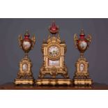 A FRENCH 19TH CENTURY PORCELAIN AND GILT-METAL CLOCK GARNITURE,