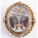 AN EARLY VICTORIAN HAIR LOCKET MEMORIAL BROOCH,