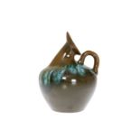 CHRISTOPHER DRESSER FOR LINTHORPE POTTERY A EWER, with dark green glaze and loop handle, no number,