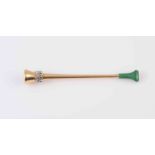 AN ASPREY DIAMOND AND EMERALD CIGARETTE HOLDER, of trumpet form with green plastic mouthpiece,