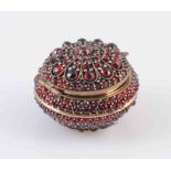 AN INDIAN GARNET SET BOX, 18TH/19TH CENTURY, of bombe form with hinged circular cover,