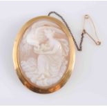 TWO VICTORIAN SHELL CAMEO BROOCHES, both oval mounts carved to the centre,