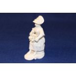 A FRENCH PORCELAIN FIGURE, POSSIBLY ORLEANS OR MENNECY,