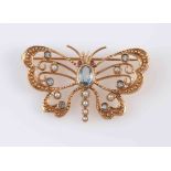 AN AQUAMARINE, SEED PEARL AND YELLOW GOLD BROOCH, modelled as a butterfly,