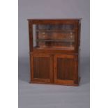 A LATE 19TH CENTURY ROSEWOOD COLLECTORS CABINET, the glazed upper section with two shelves,