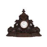 A 19TH CENTURY CARVED OAK SHELF CLOCK, the white enamel dial with Roman numerals,