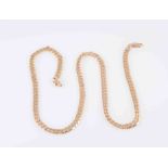 A YELLOW GOLD NECKLACE CHAIN, of flat curb links on lobster catch. Clasp stamped 375 9KT.