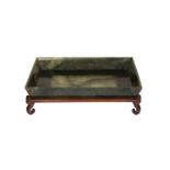 A CHINESE JADE SHALLOW BOWL, rectangular, spinach coloured, on a wooden stand. Bowl 21.