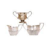 A GEORGE V SILVER CREAM JUG AND SUGAR BOWL, Walker & Hall,