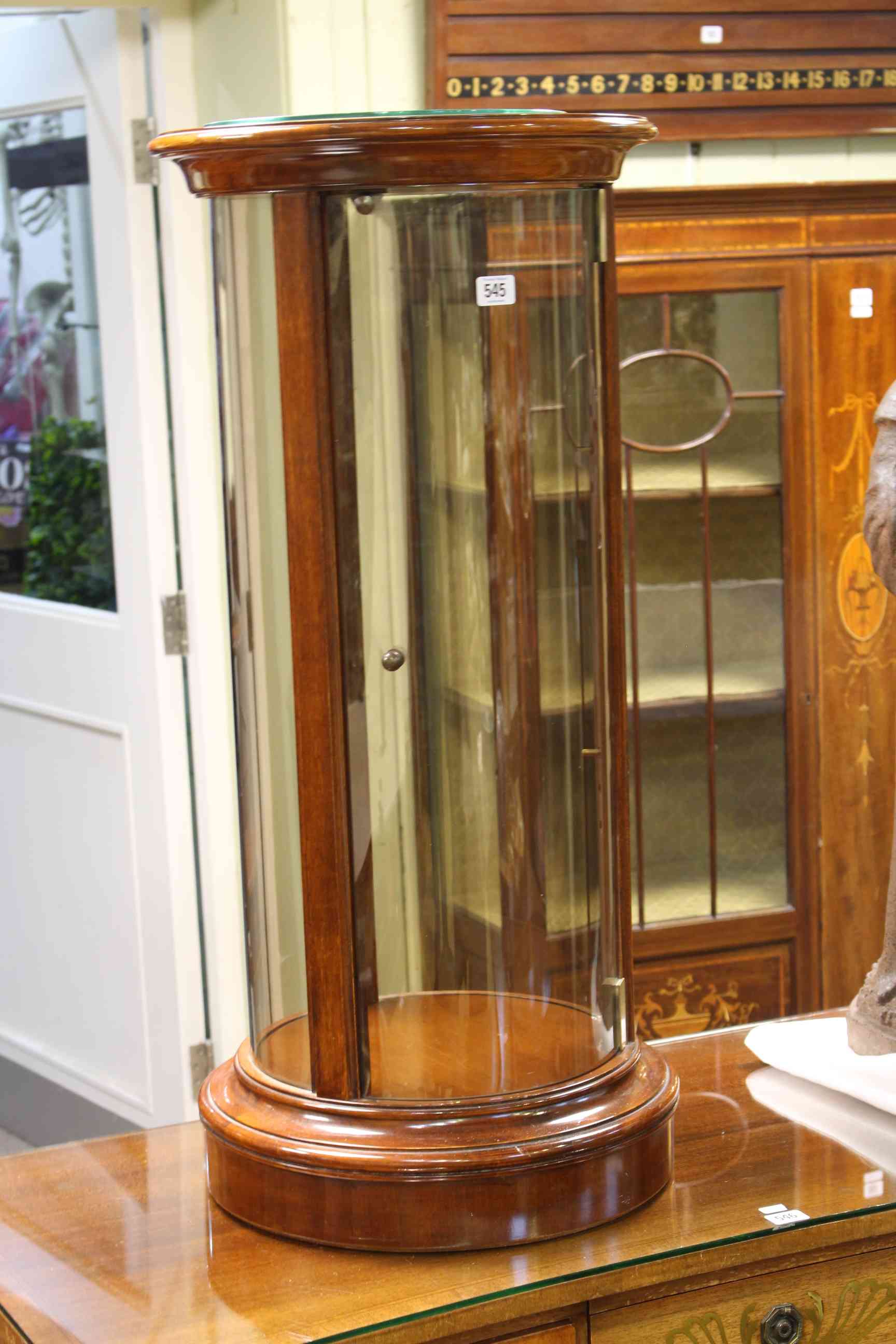 Polished mahogany cylindrical display case