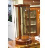 Polished mahogany cylindrical display case