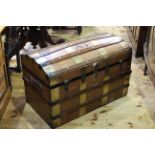 Dome topped brass and wood bound cabin trunk