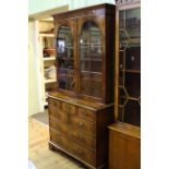 Good quality burr walnut bookcase having two glazed panel doors above a base of seven drawers