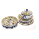 Collection of French faience plates, dishes, covered bowl and chamberstick,