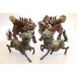 Pair of red glazed stoneware Kylin and pair of moulded models of Kylin