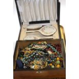 Two enamel backed cased dressing table sets and box of costume jewellery