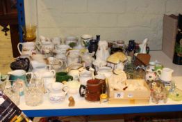 Assorted china jugs, Wade and glass figures, glassware,