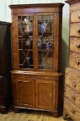 Georgian style elm double corner cabinet having two astragal glazed doors above two panelled