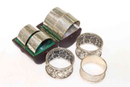 Three pairs and a single silver napkin rings (7)