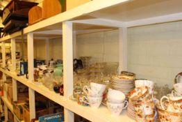 Full shelf of teawares, dinnerwares,