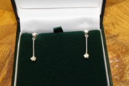 Pair of diamond and 18 carat white gold drop earrings