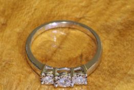 9 carat gold and three-stone diamond ring