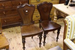 Pair Victorian mahogany shaped panel back hall chairs