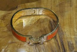 Hermes enamelled bangle with H-clasp