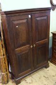 19th Century oak fielded panel two door bookcase with four adjustable shelves