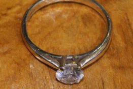 18 carat gold and single-stone diamond ring