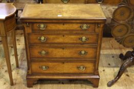 Burr walnut cross-banded four drawer bachelor chest