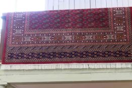 Bokhara carpet with a red ground 2.80 by 2.