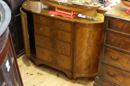 Mahogany breakfront side cabinet having four central drawers flanked by two bow cupboard doors