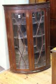 Mahogany astragal glazed double door bow front corner wall cabinet