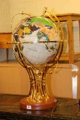 Semi-precious stone illuminated celestial globe and brass and wood stand