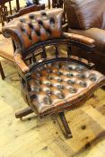 Brown buttoned leather captains style swivel desk chair