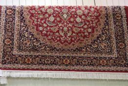 Keshan carpet with a red ground 2.03 by 1.