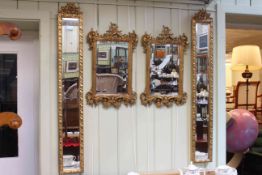Pair ornate gilt framed bevelled wall mirrors