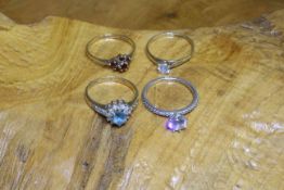Three 9 carat gold rings and a silver ring (4)