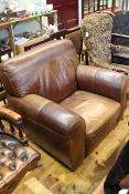 Distressed brown leather easy chair