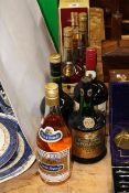 Three bottles of Hennessy Cognac, Courvoisier Cognac, Prince Hubert Cognac,