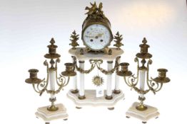 Clock garniture in gilt metal and white marble with columns and swags