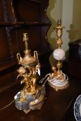 Two highly ornate gilt metal and marble table lamps