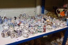 Large collection of miniature teapots and kettles