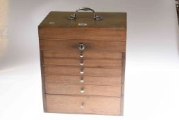 Table top collectables cabinet with shallow drawers and hinged top