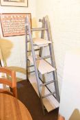 Three tier graduated ladder rack shelf unit