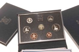 Eight Royal Mint coin sets