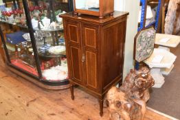 Edwardian mahogany and satinwood banded two door music cabinet