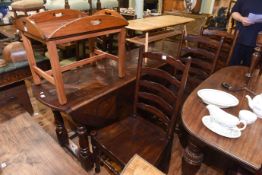 Large carved hardwood drop leaf dining table and six ladder back chairs
